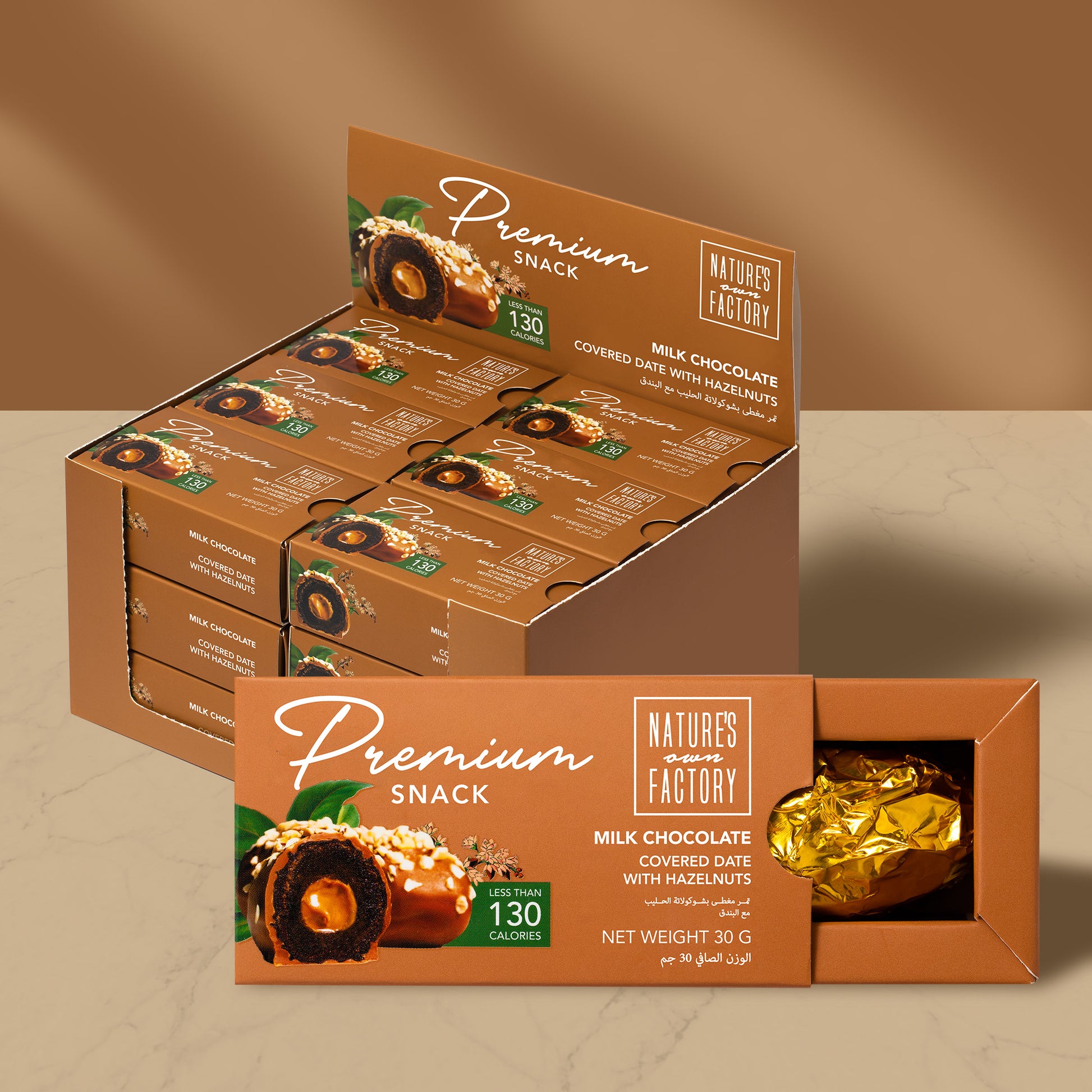 Natures own Factory chocolate covered date with hazelnuts 18 X pack, packaging on a brown background