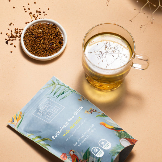 Nature's Own Factory buckwheat tea with coconut, package with ingredients on a beige background