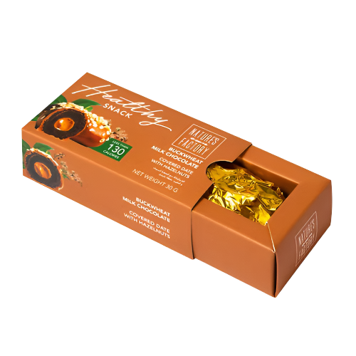 Open box of Nature’s Own Factory chocolate-covered dates with hazelnuts  individually wrapped healthy snacks, 30g