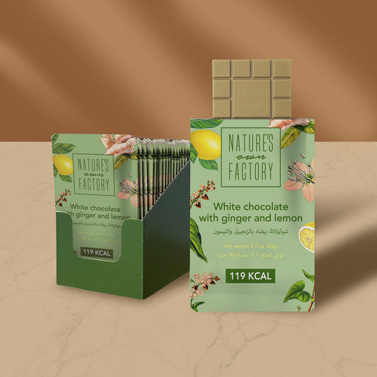 Nature’s Own Factory White Chocolate with Ginger and Lemon 24 packs 20g premium white chocolate bar made with natural ingredients, shown in elegant green packaging with lemon and floral illustrations.
