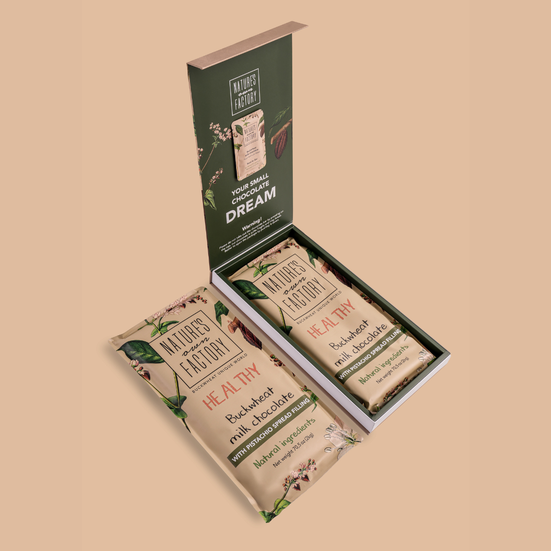 Box of Nature's Own Factory chocolate bars with Pistachio 2KG on a beige background