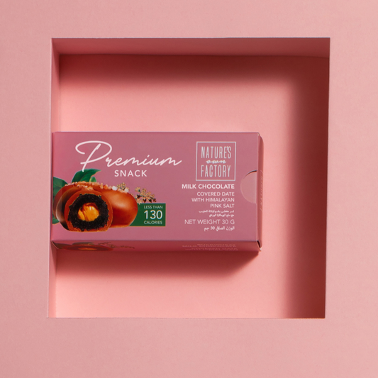 Natures own Factory chocolate covered date with himalayan pink salt, packaging on a pink background