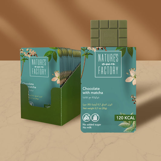 Nature's Own Factory chocolate with matcha bar packaging with a beige background