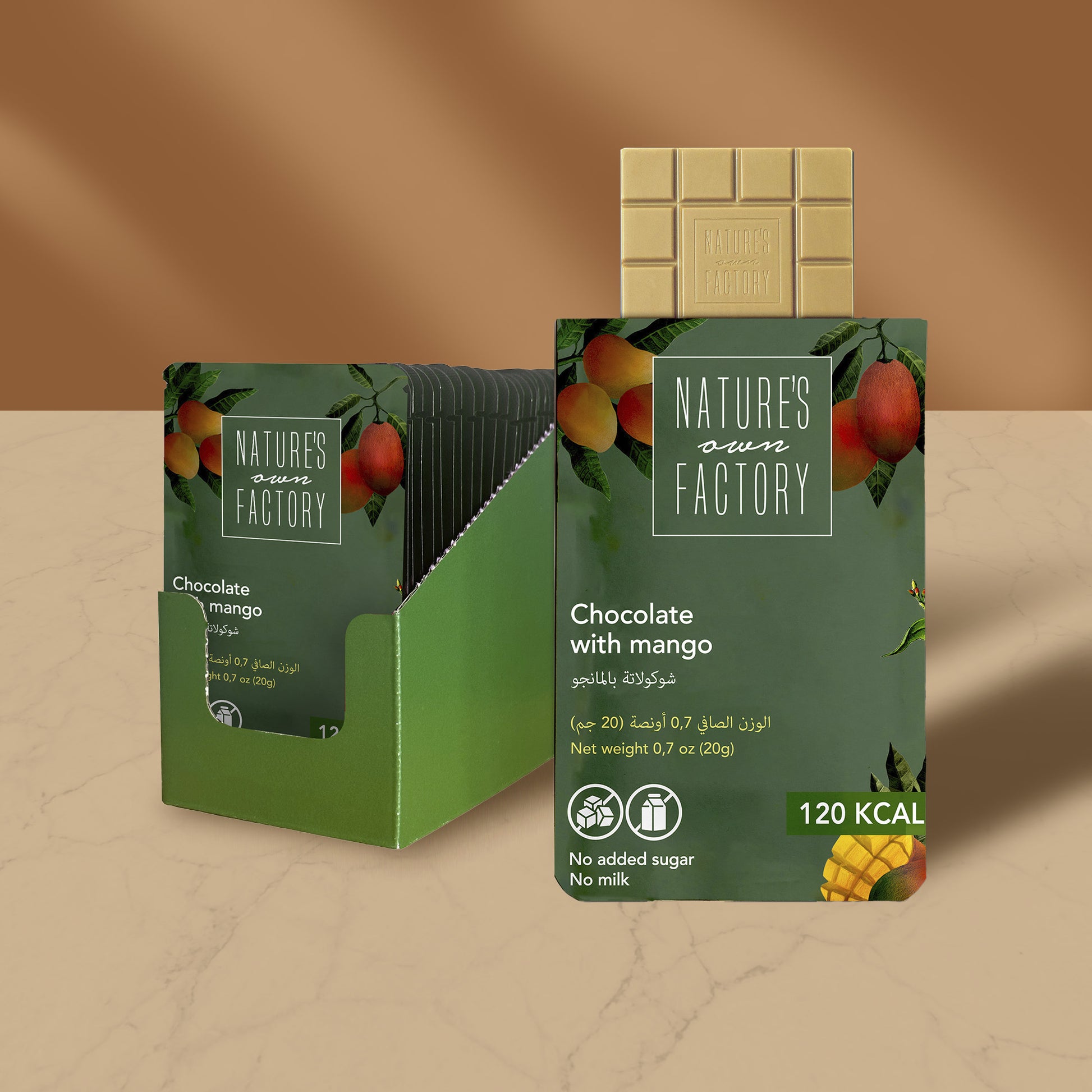Nature's Own Factory chocolate with mango 24xpack, packaging on a beige background.
