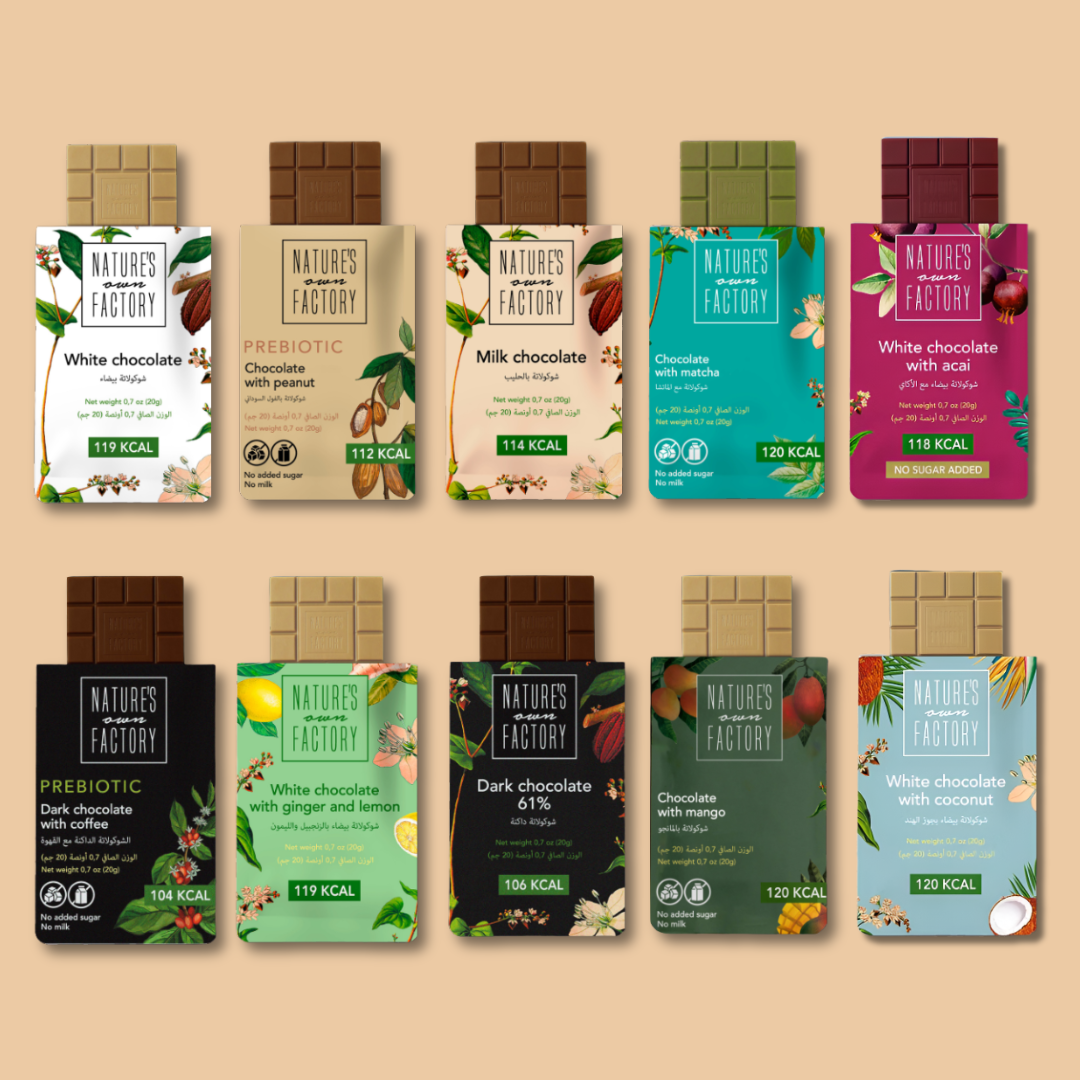 All available flavors of Nature's Own Factory chocolate bars on a beige background