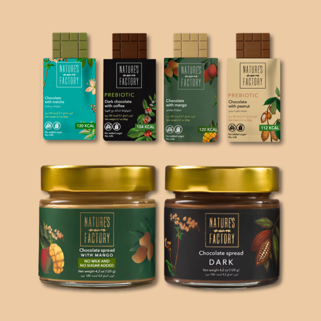 Collection of Nature's own Factory products including chocolate bars and spreads on a beige background