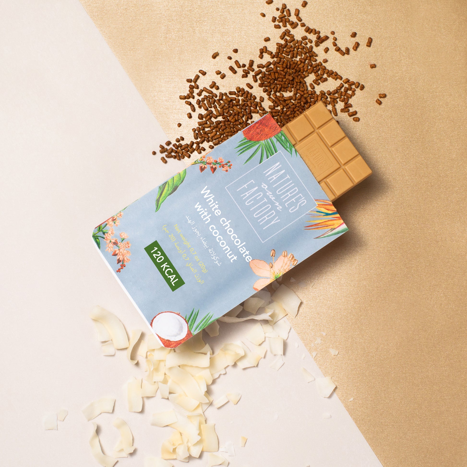 Nature's Own Factory Chocolate bar with coconut and packaging with flakes and buckwheat on a beige background